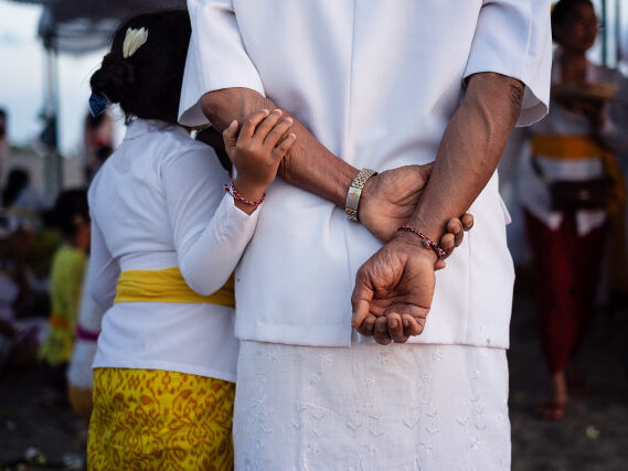 Child Holding Relatives Arm