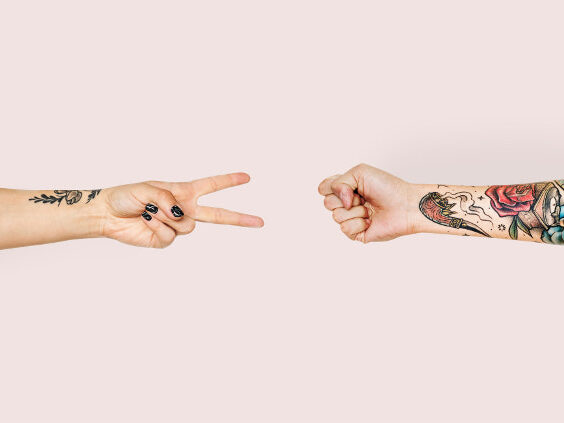 Two People Playing Rock Paper Scissors