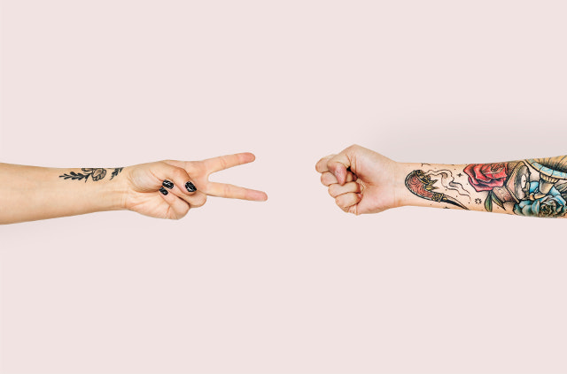 Two People Playing Rock Paper Scissors