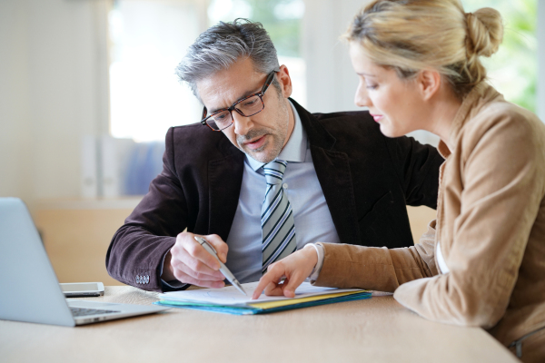 Two People Review Paperwork