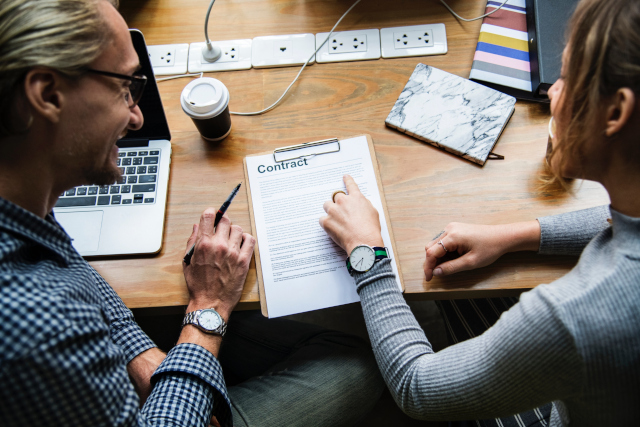 Two People Reviewing Contract