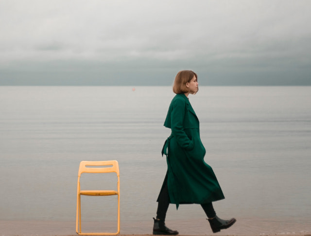 Walking Alone Along The Beach