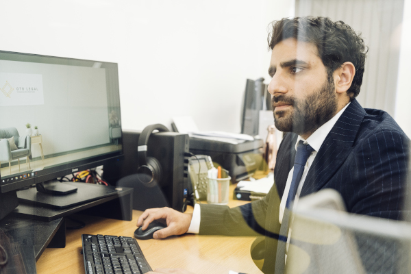 Amrit Working At Computer