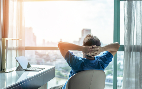 Man At Desk Looking At The View