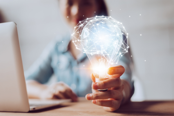 Person Holding Lightbulb