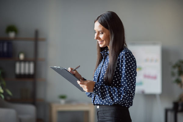 Woman Holding Clipboard