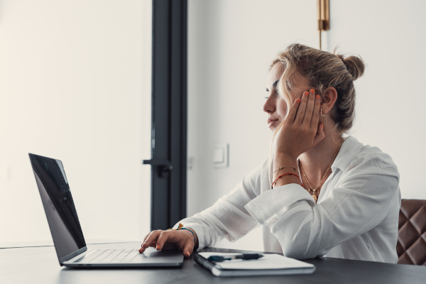 Woman Sitting At Laptop