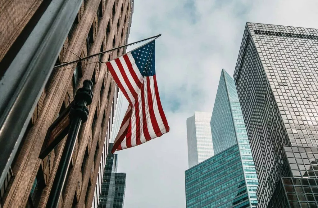 US Flag Hanging From Building