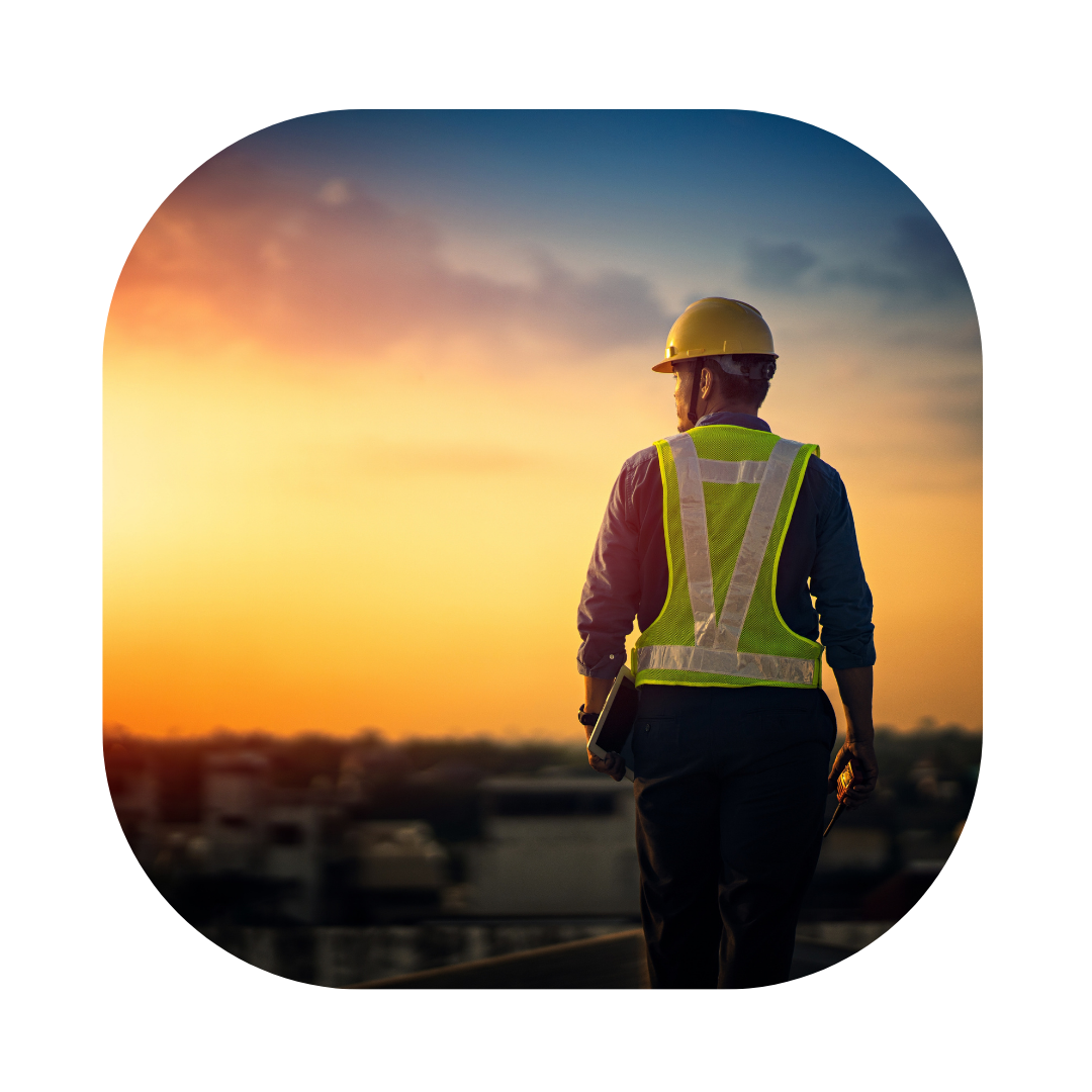 UK Skilled Worker Visa. Man with helmet on at work