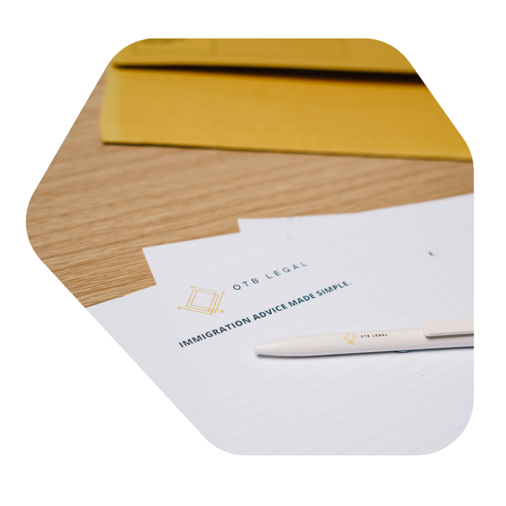 Child Dependent Visa Solicitor UK Documents on Table with a pen