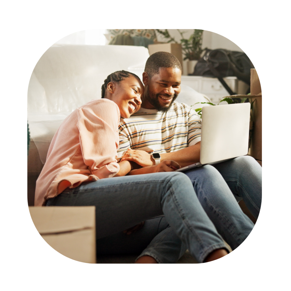 Couple on the sofa looking into Indefinite Leave to Remain UK Spouse Solicitors