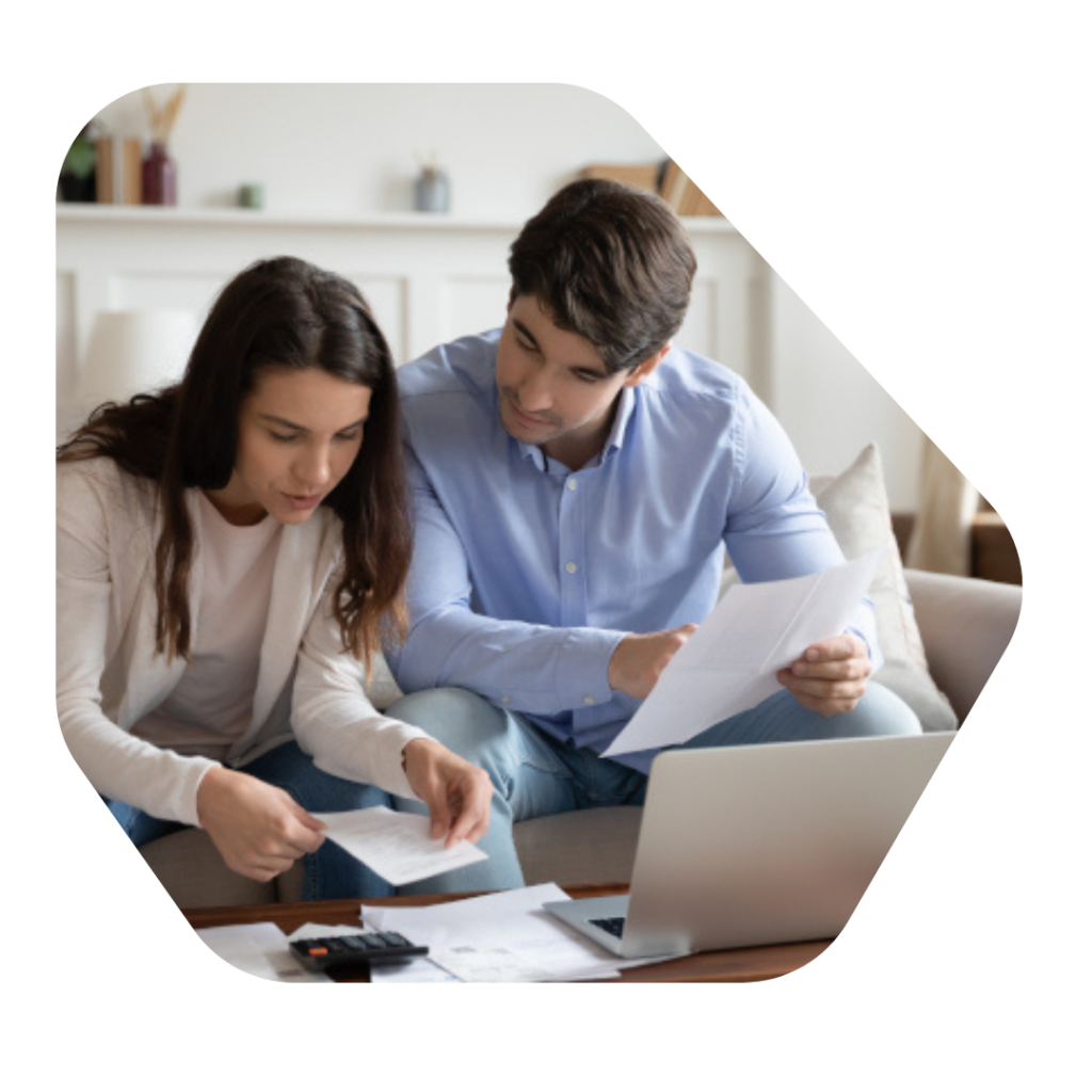 Couple looking through papers for Indefinite Leave to Remain UK Spouse Solicitors Information