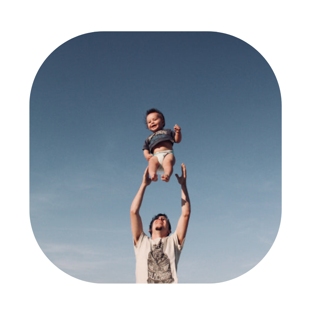 Father lifting up his child. British Citizenship for Child born in UK Solicitor