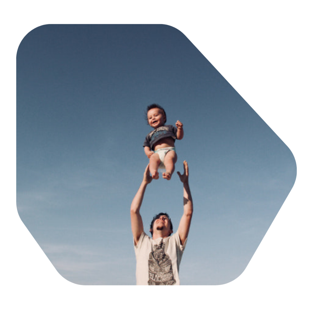 Dad throwing son in the air. Parent of a Child Visa UK Lawyer