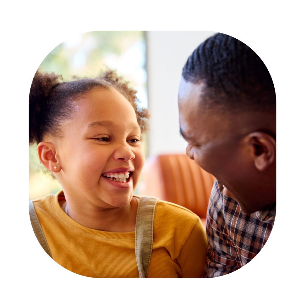 Daughter and father smiling at each other. British Citizenship for Child born in the UK