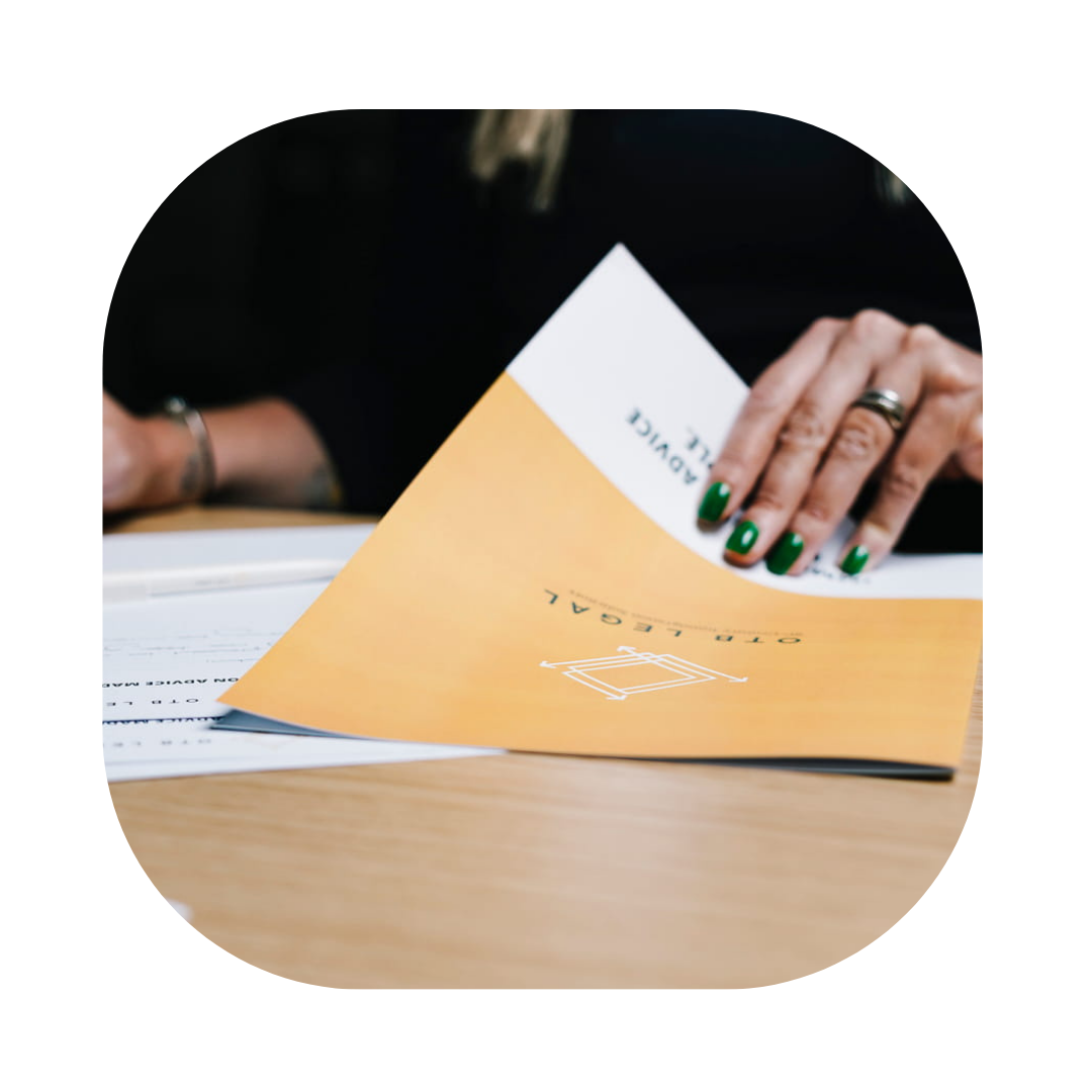 Female looking at a OTB Legal document about Fee Waiver Application Lawyers UK