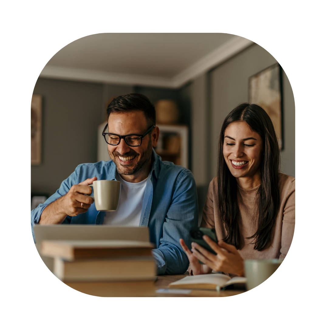 Couple at a laptop searching for Spouse Visa Extension UK Lawyers