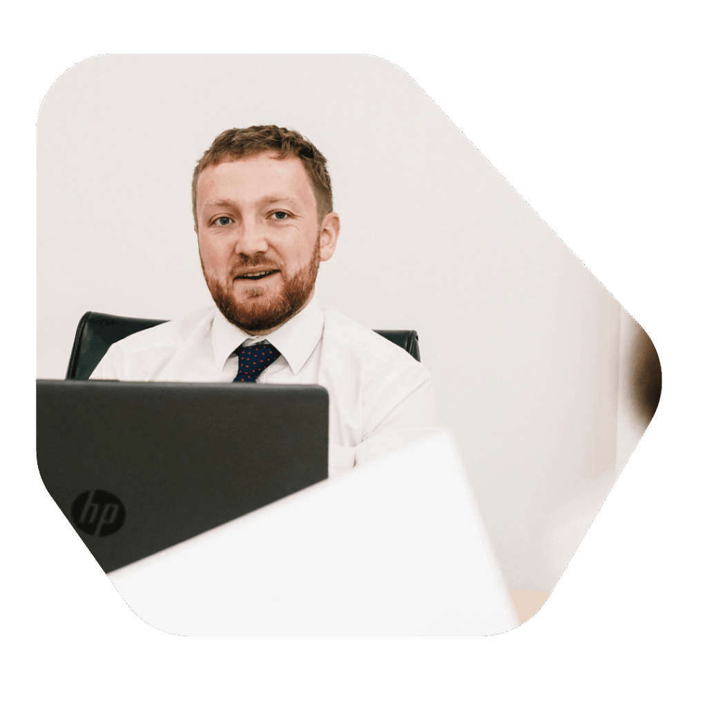 Accounts manager at desk discussing Private Life Visa UK costs