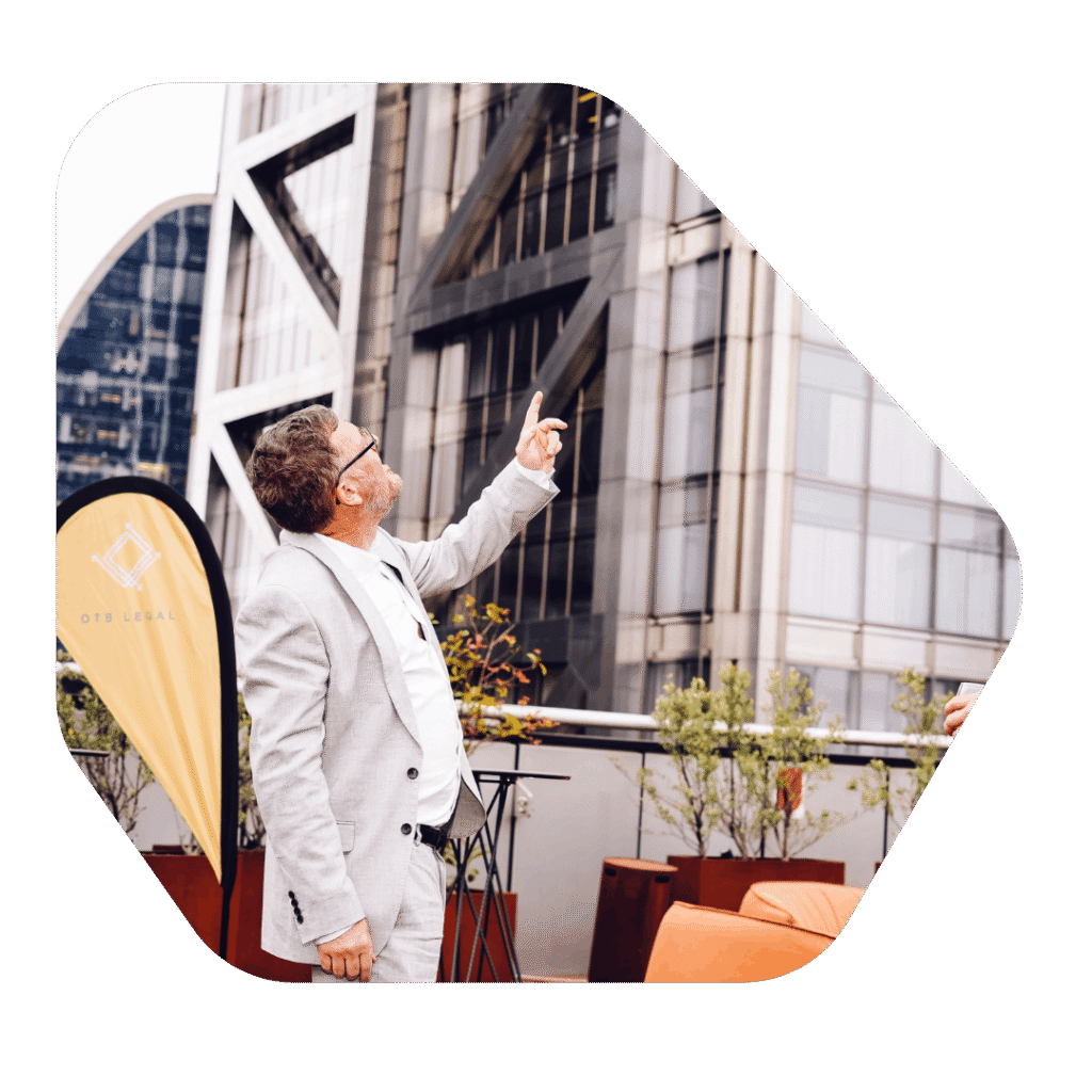 Lawyer looking at high rise buildings. Tier 1 Entrepreneur Visa UK Extension