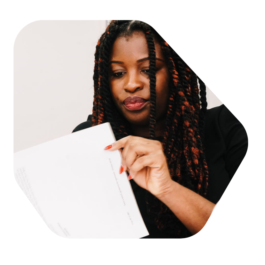 Female Solicitor looking at a document. British Citizenship for Child born in the UK price
