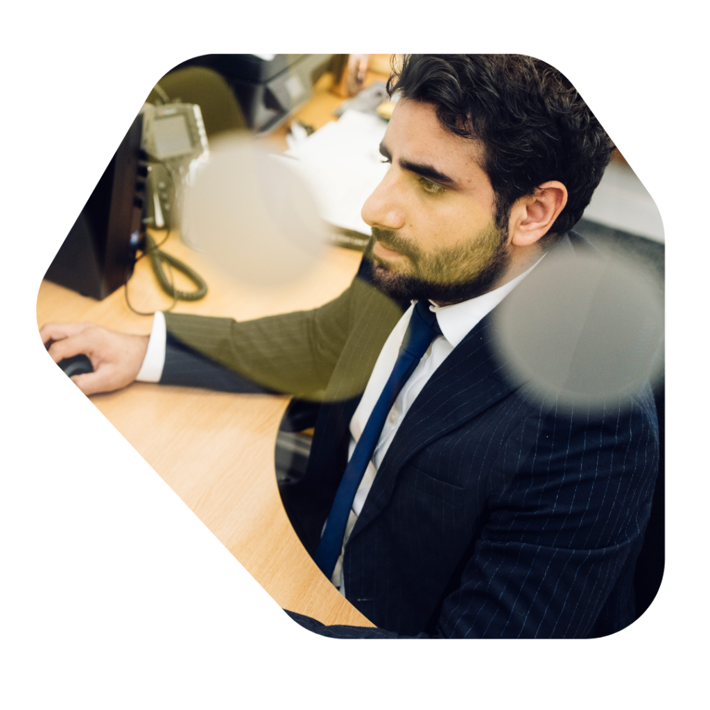 Male Solicitor working at computer. British Citizenship for Child born in the UK Visa