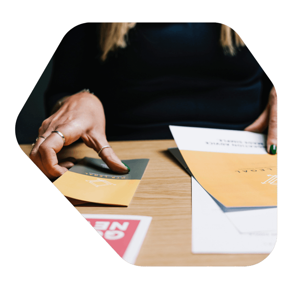 OTB Legal leaflets on a desk. Fee Waiver Application Lawyers UK Solicitor