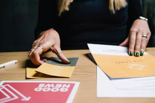 Solicitor writing on documents about Undefined Certificate of Sponsorship