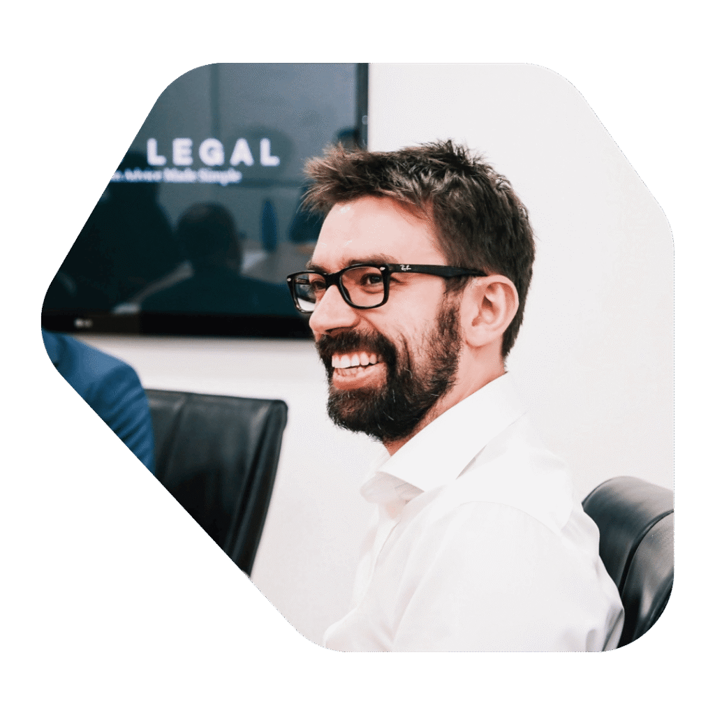 Immigration Lawyer Hastings smiling in a meeting