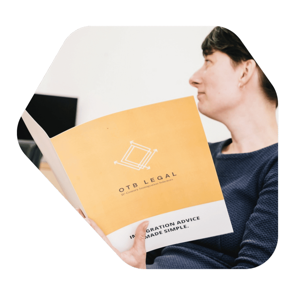 Immigration Lawyer Hemel Hempstead holding OTB Legal document