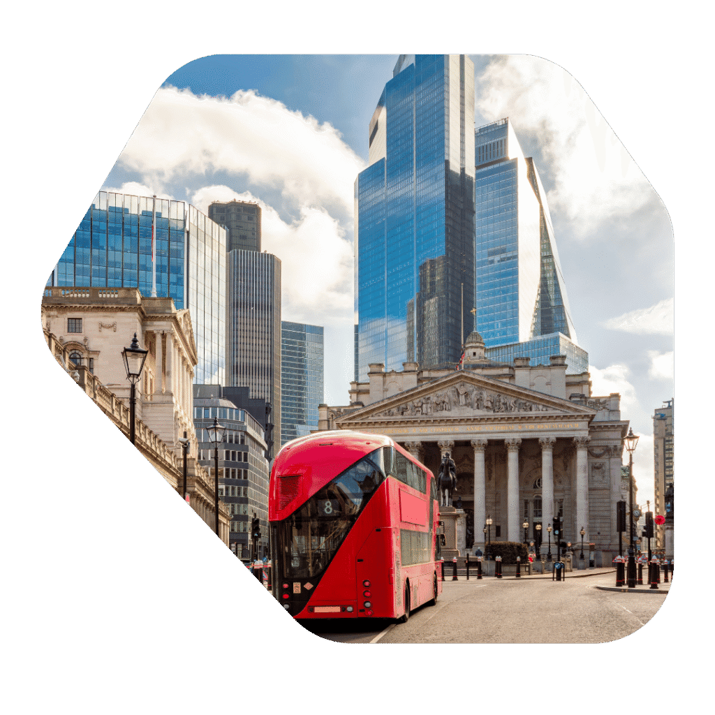 Red London Bus driving past high rise buildings in London. Immigration Lawyers London